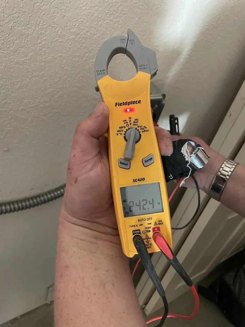 Voltage testing with clamp meter during Electrical Installation Services in Gibsonton